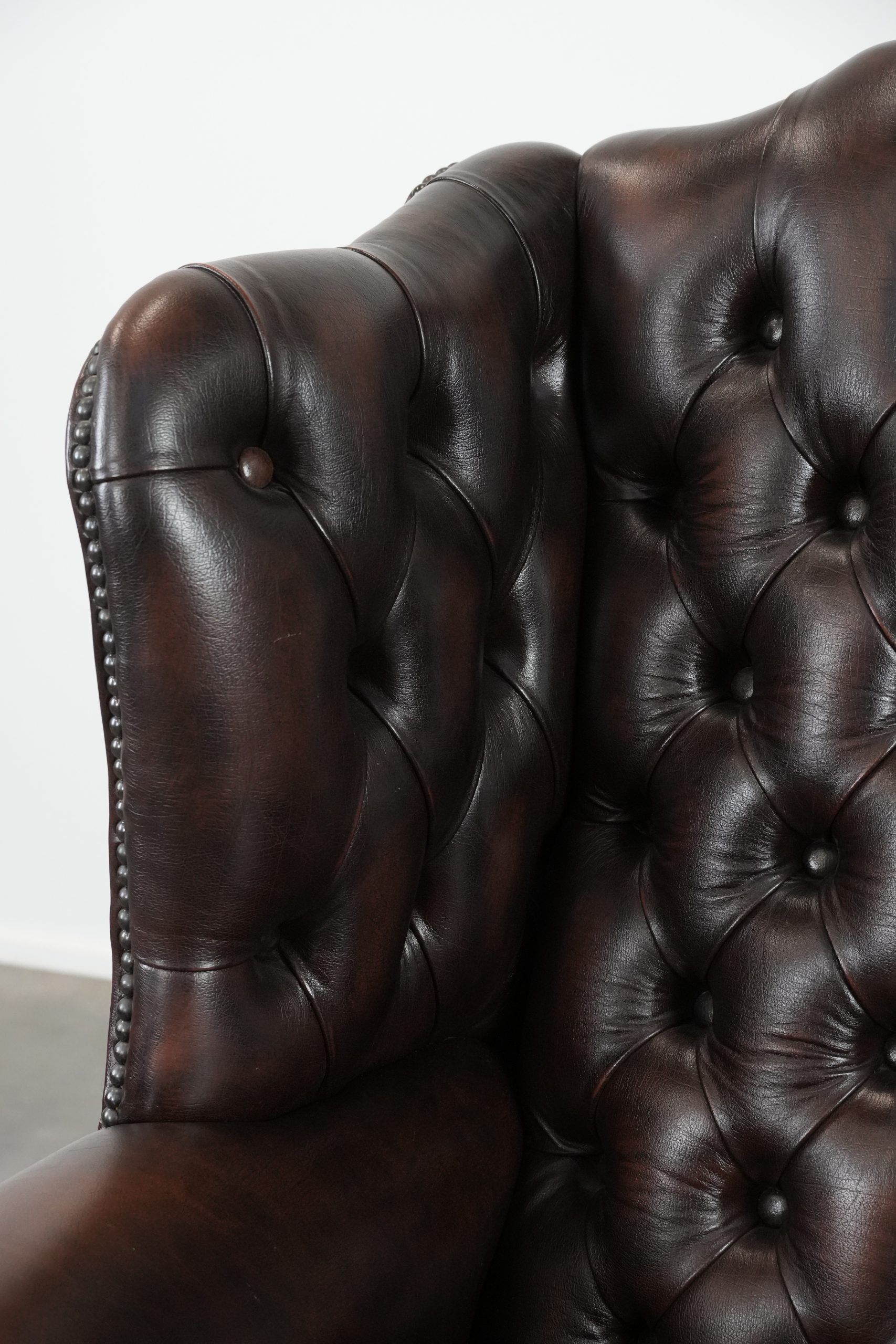 Brown cowhide leather Chesterfield wingback armchair in English style