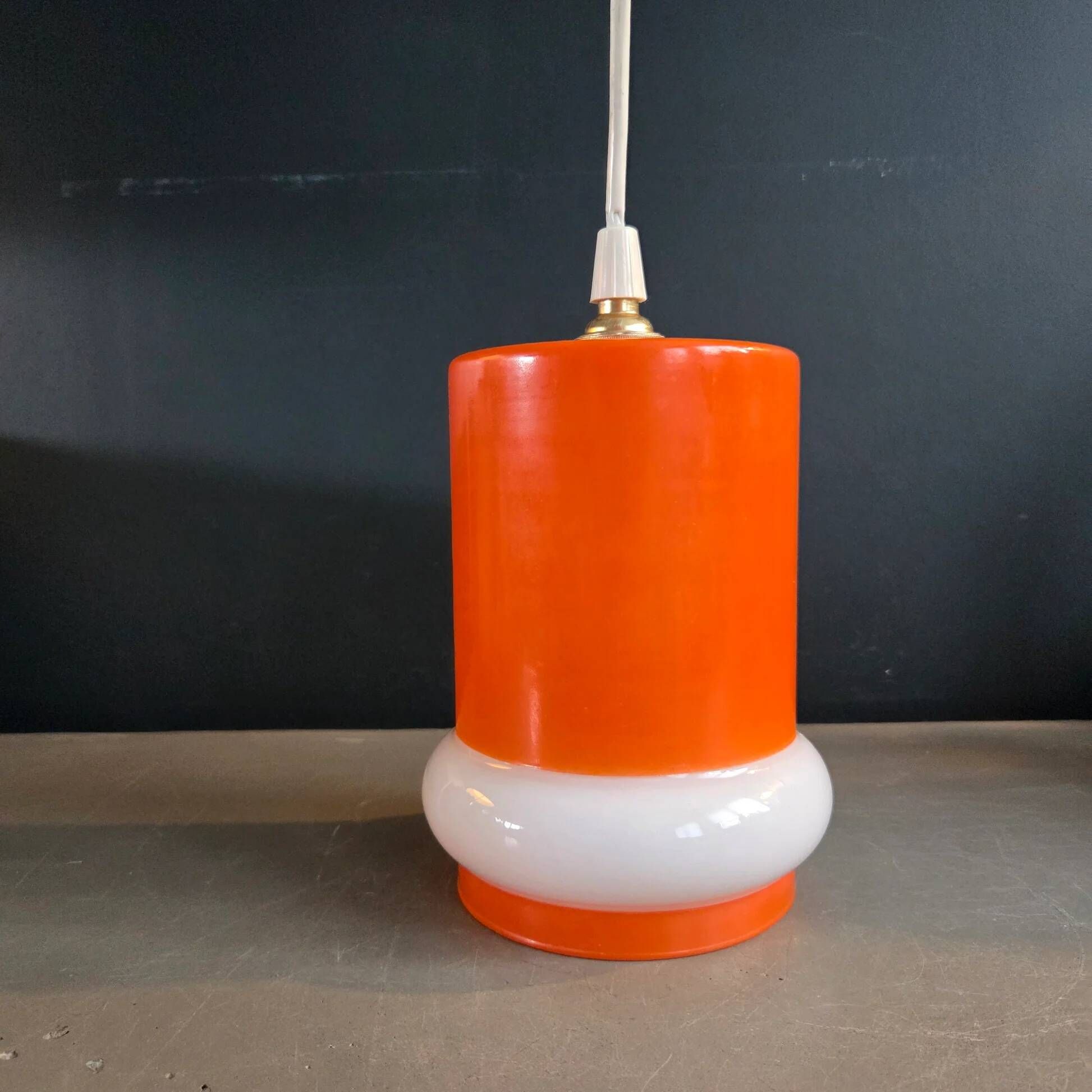 Vintage suspension in orange and white glass.