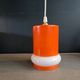 Vintage suspension in orange and white glass.
