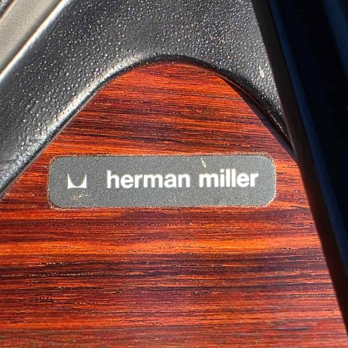 Original Eames lounge chair by Herman Miller in burgundy rosewood.
