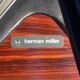 Original Eames lounge chair by Herman Miller in burgundy rosewood.