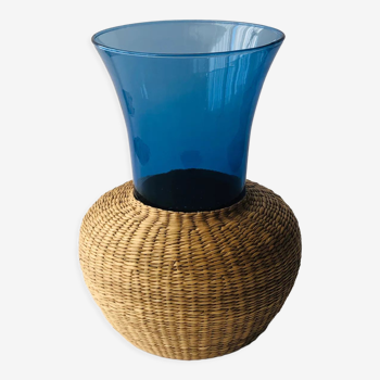 Blue blown glass vase and basketry