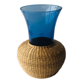 Blue blown glass vase and basketry
