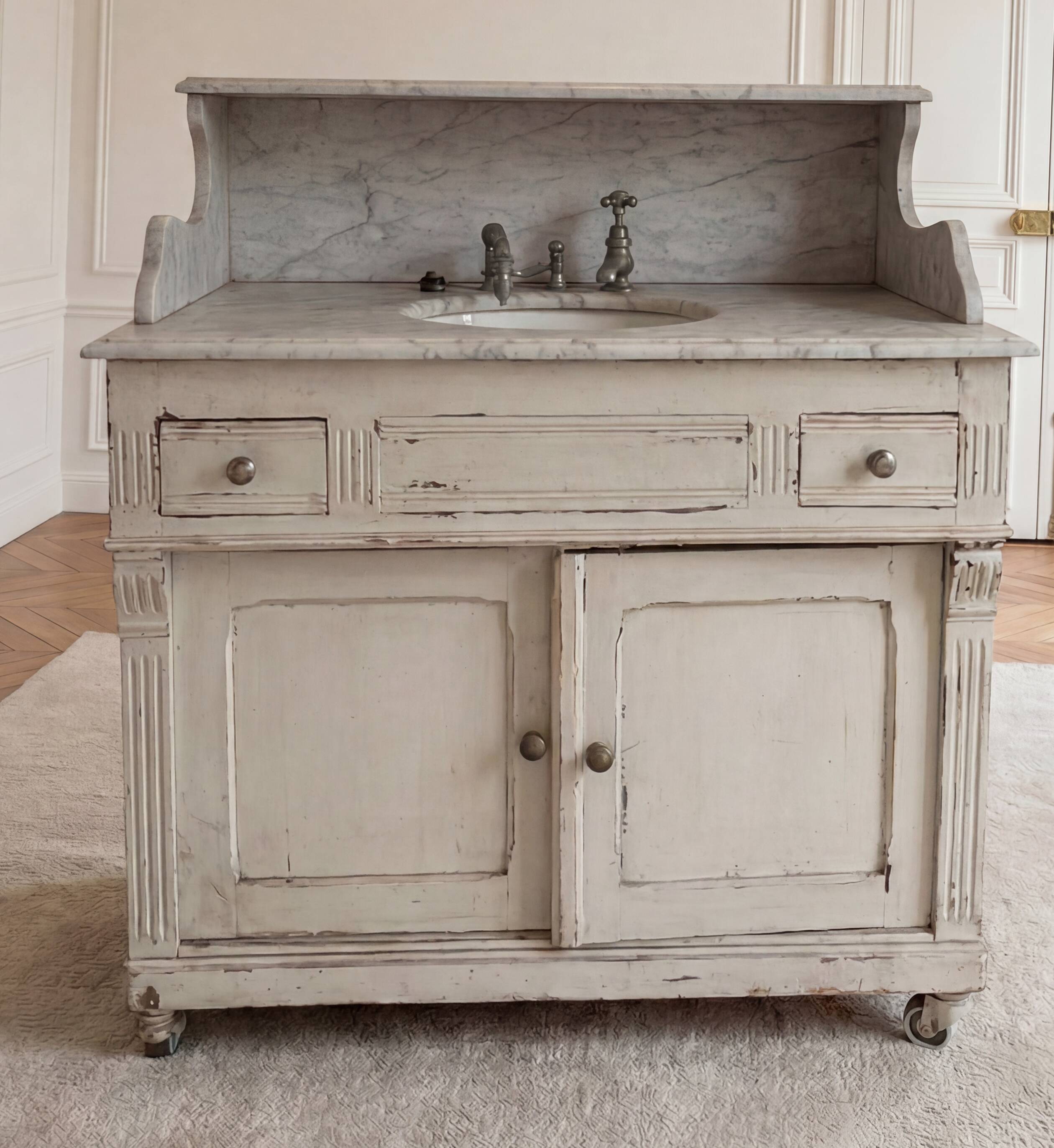 Antique wooden bathroom cabinet with painted finish and white marble.