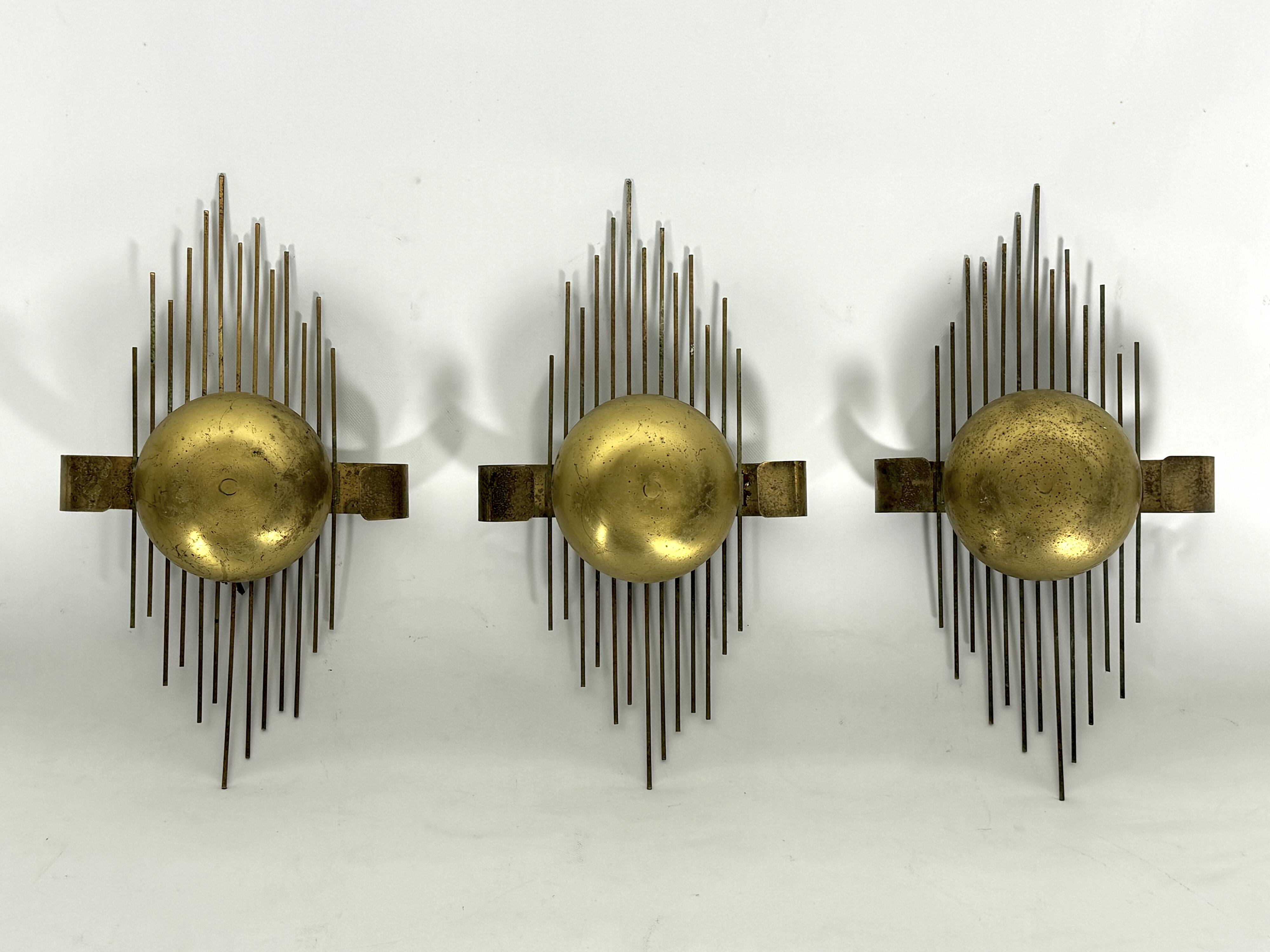 Mid-Century Set of three gilded metal sconces. Italy 1950s