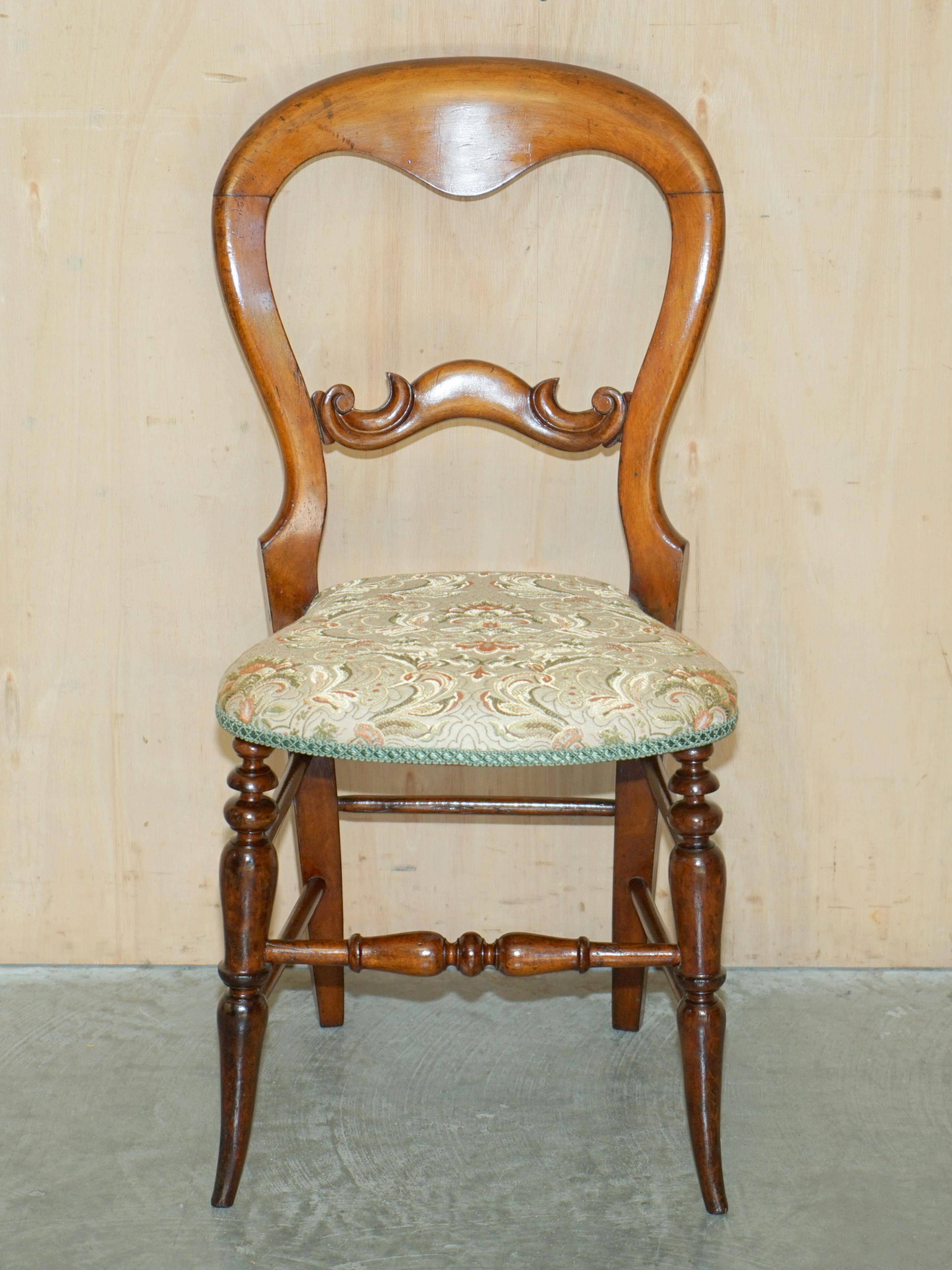 Victorian walnut dressing table chair from around 1880 with a medallion on the backrest.