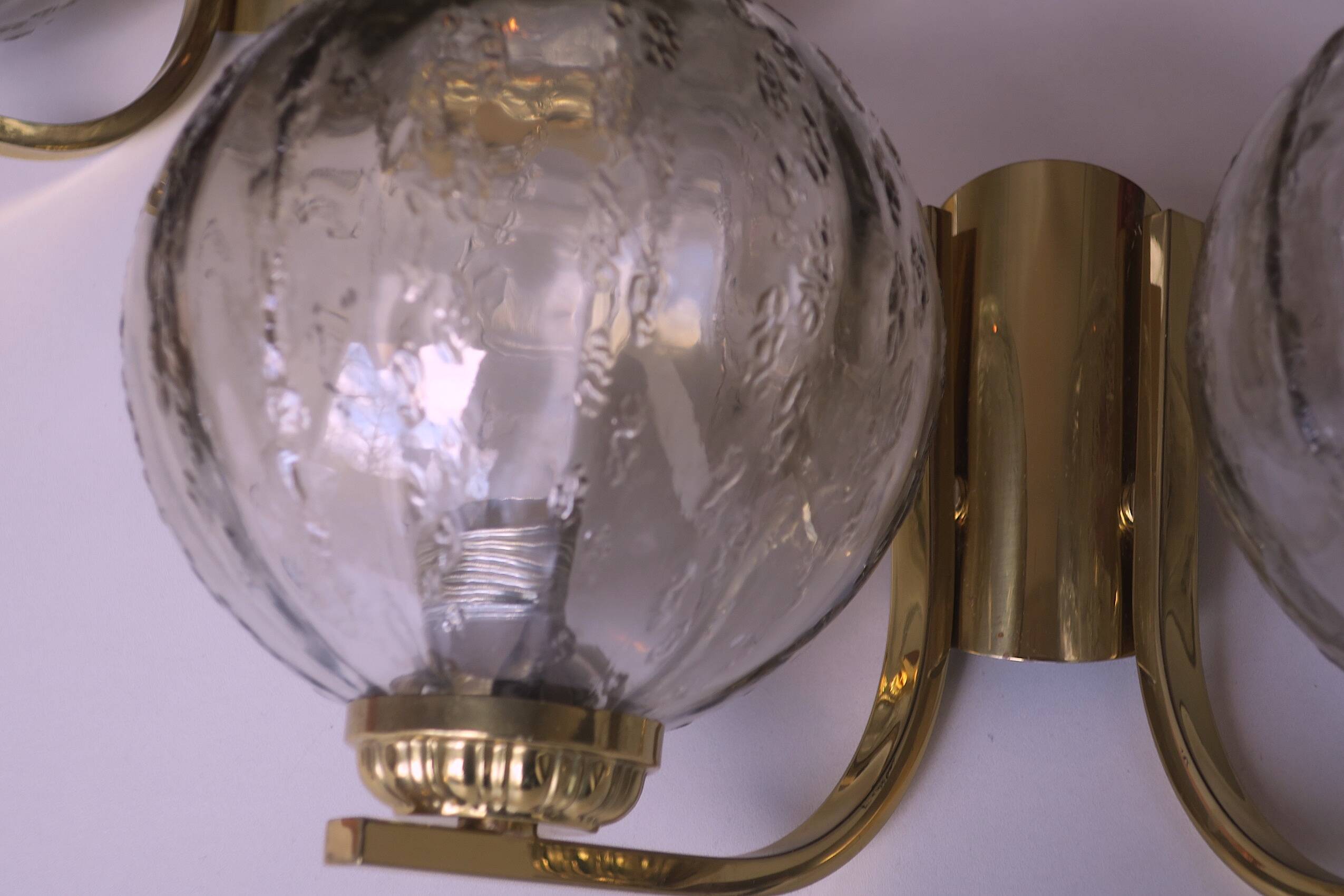 Mid century pair of brass and glass double wall lights, 1970s