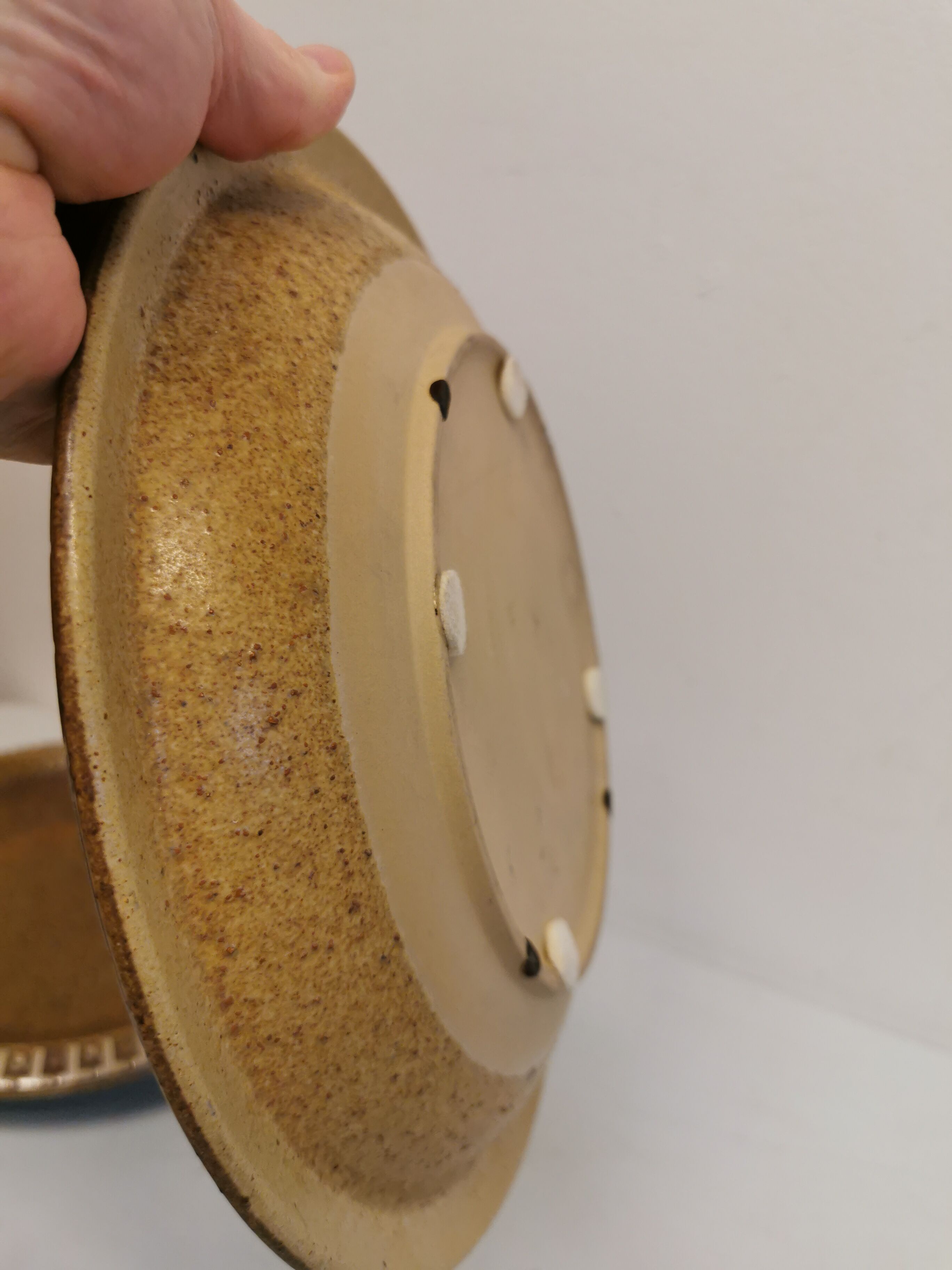 Ceramic plates, designed and made by Danish Ravnild (both stamped and signed)