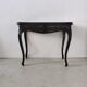 Molded blackened wooden play table, arched legs, green felt