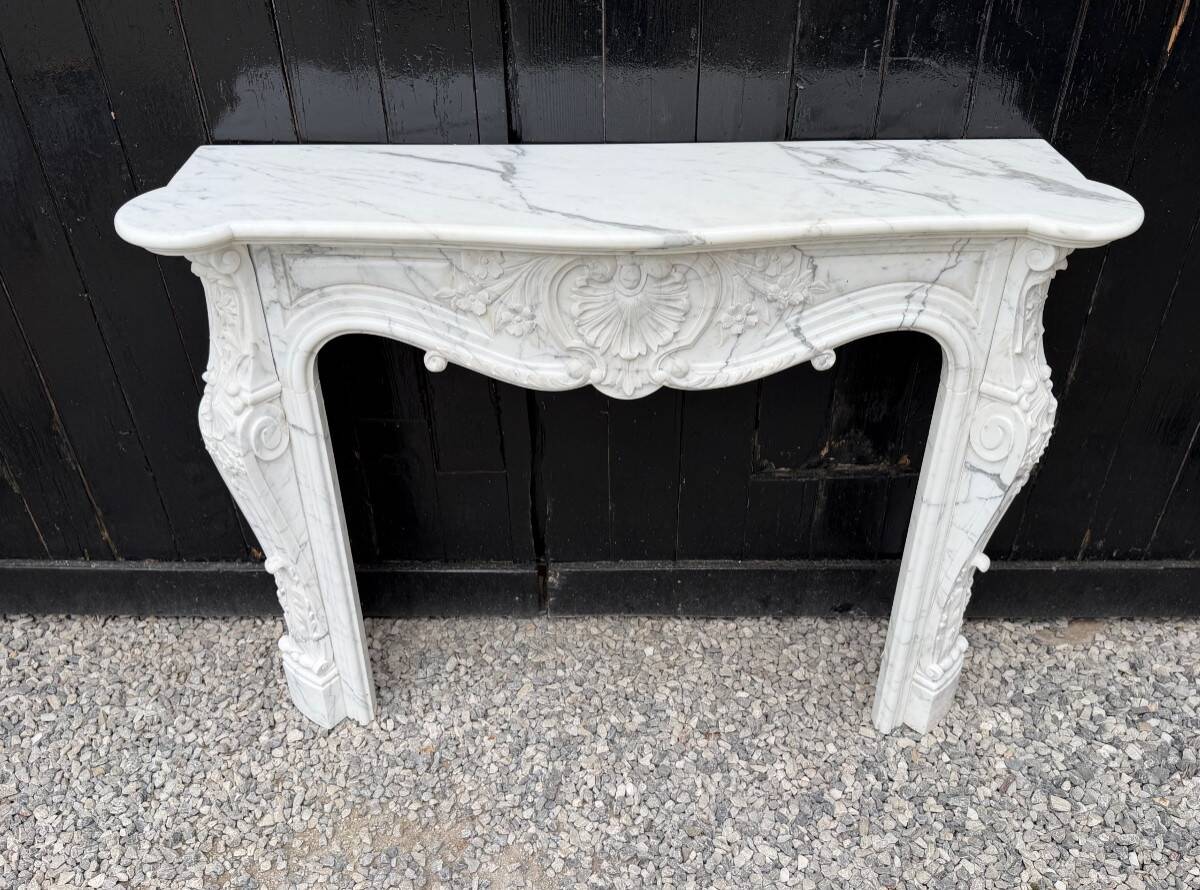 Louis XV style fireplace in Carrara marble, circa 1980.