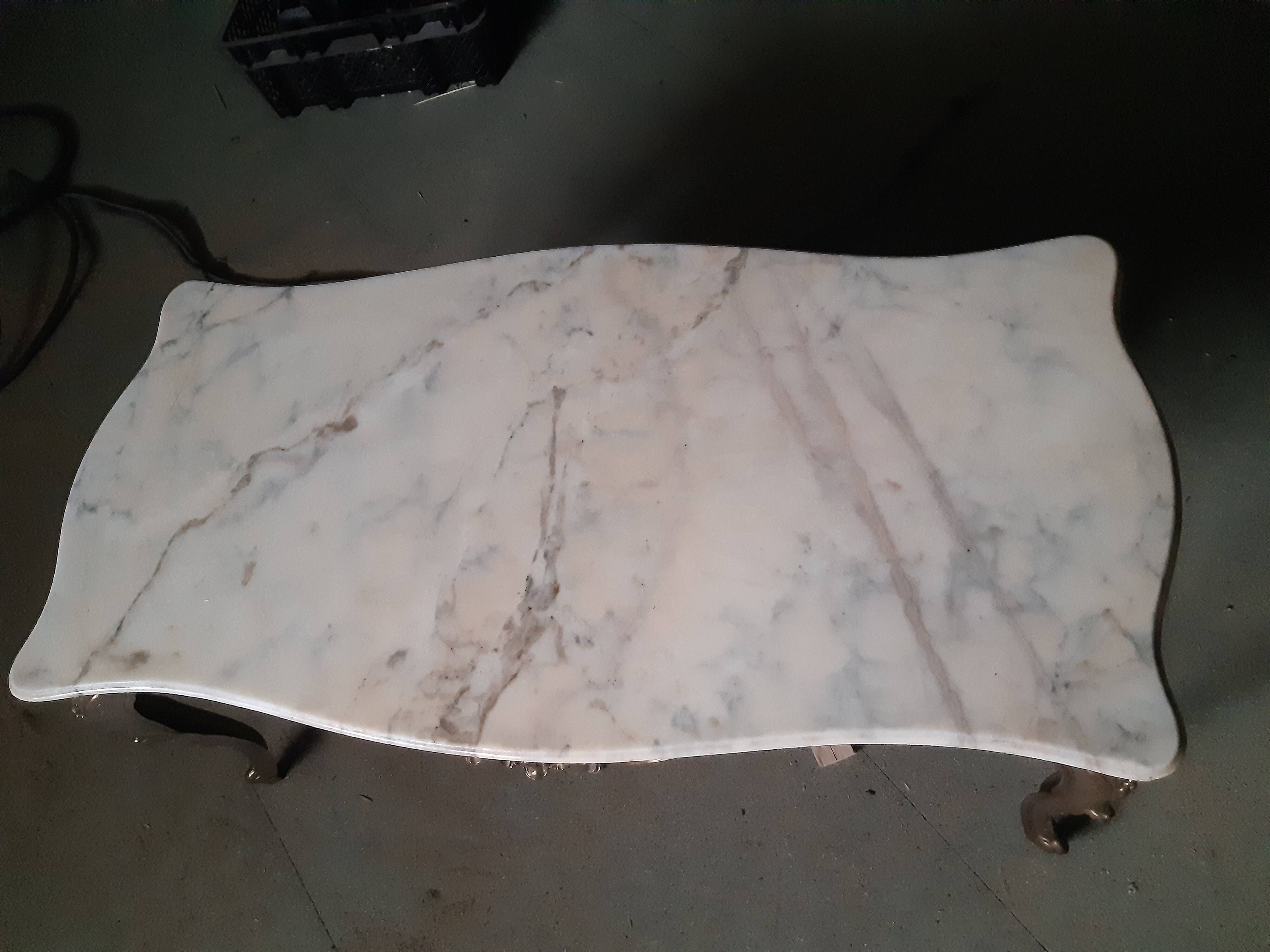 Pedestrian coffee table above marble