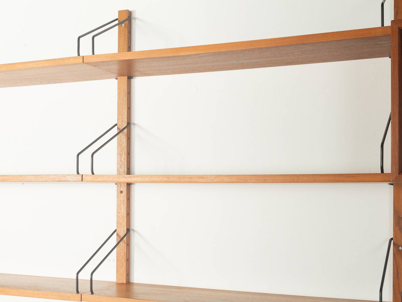 Classic shelving system from the 1950s in teak veneer by Poul Cadovius for Cado
