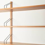 Classic shelving system from the 1950s in teak veneer by Poul Cadovius for Cado