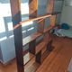 Asymmetrical wall or divider bookcase in dark wood