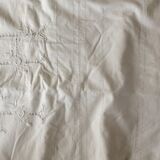 Old white sheet several rows of days lapel monogram