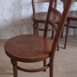 Set of 4 Baumann bistro chairs with round seats.