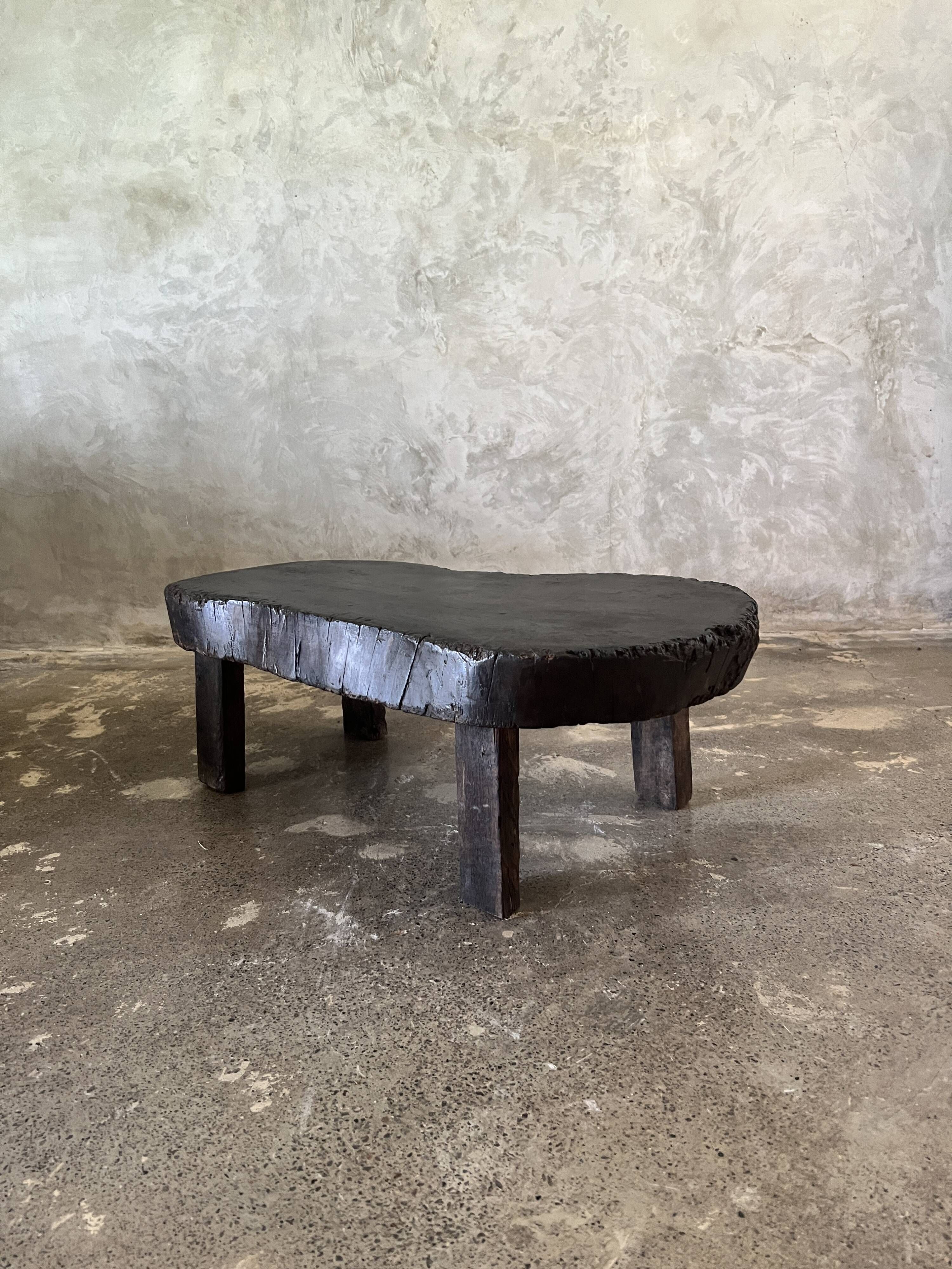 Small old Asian wooden coffee table in Japanese style, kidney-shaped top
