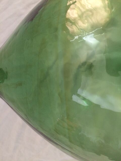 Demijohn with a beautiful glass mixing green and brown