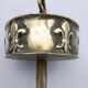 Ashtray on foot. Bronze and brass, with fleur-de-lis decoration.