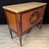 Louis XVI style commode inlaid with a decoration of instruments.