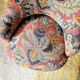 Small "madame" toad chair, vintage, upholstered in multicoloured floral fabric.