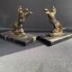 Pair of art deco marble and patinated regulated bookends