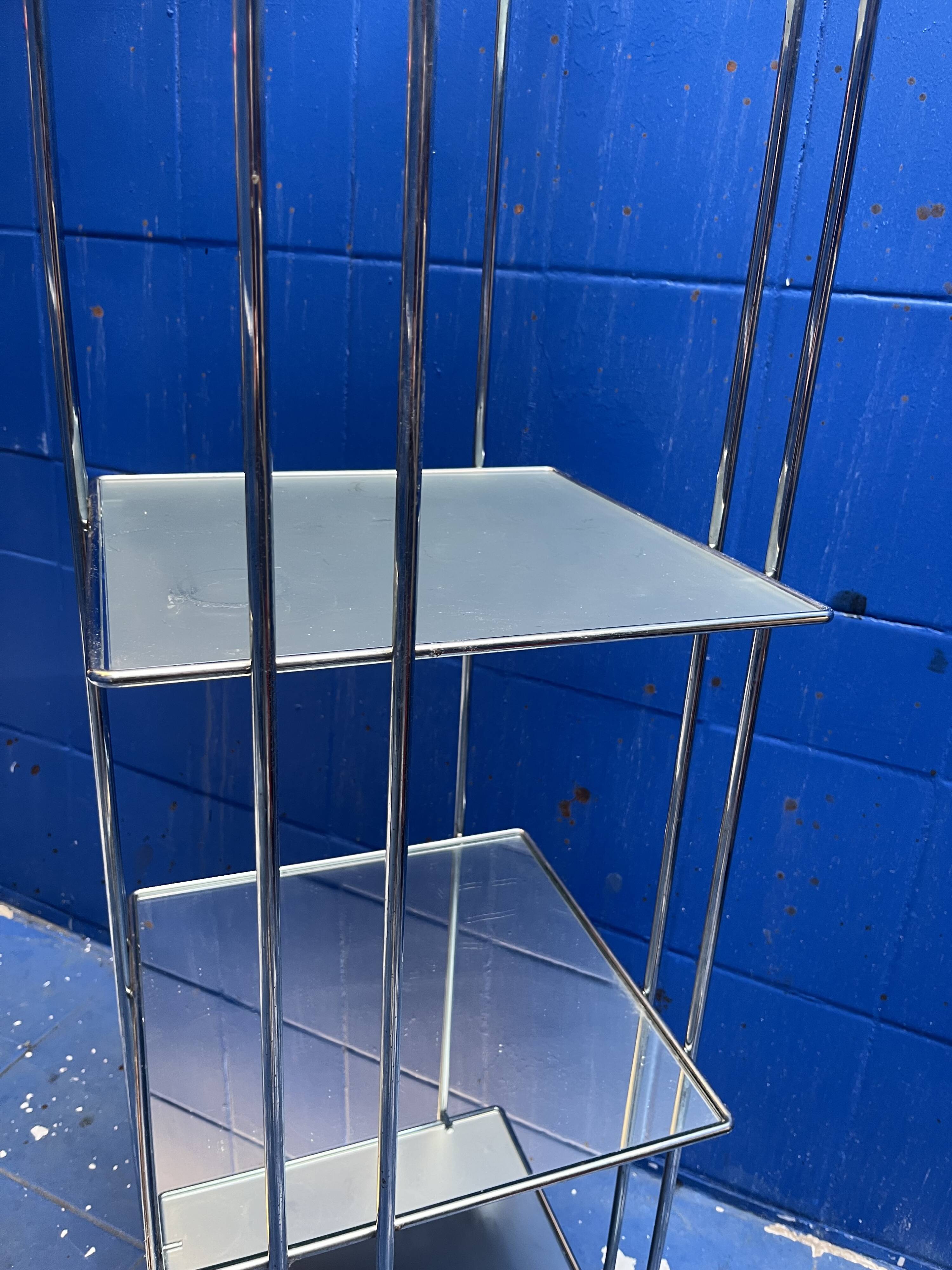 chrome and glass shelving unit on wheels from the 90s