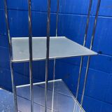chrome and glass shelving unit on wheels from the 90s
