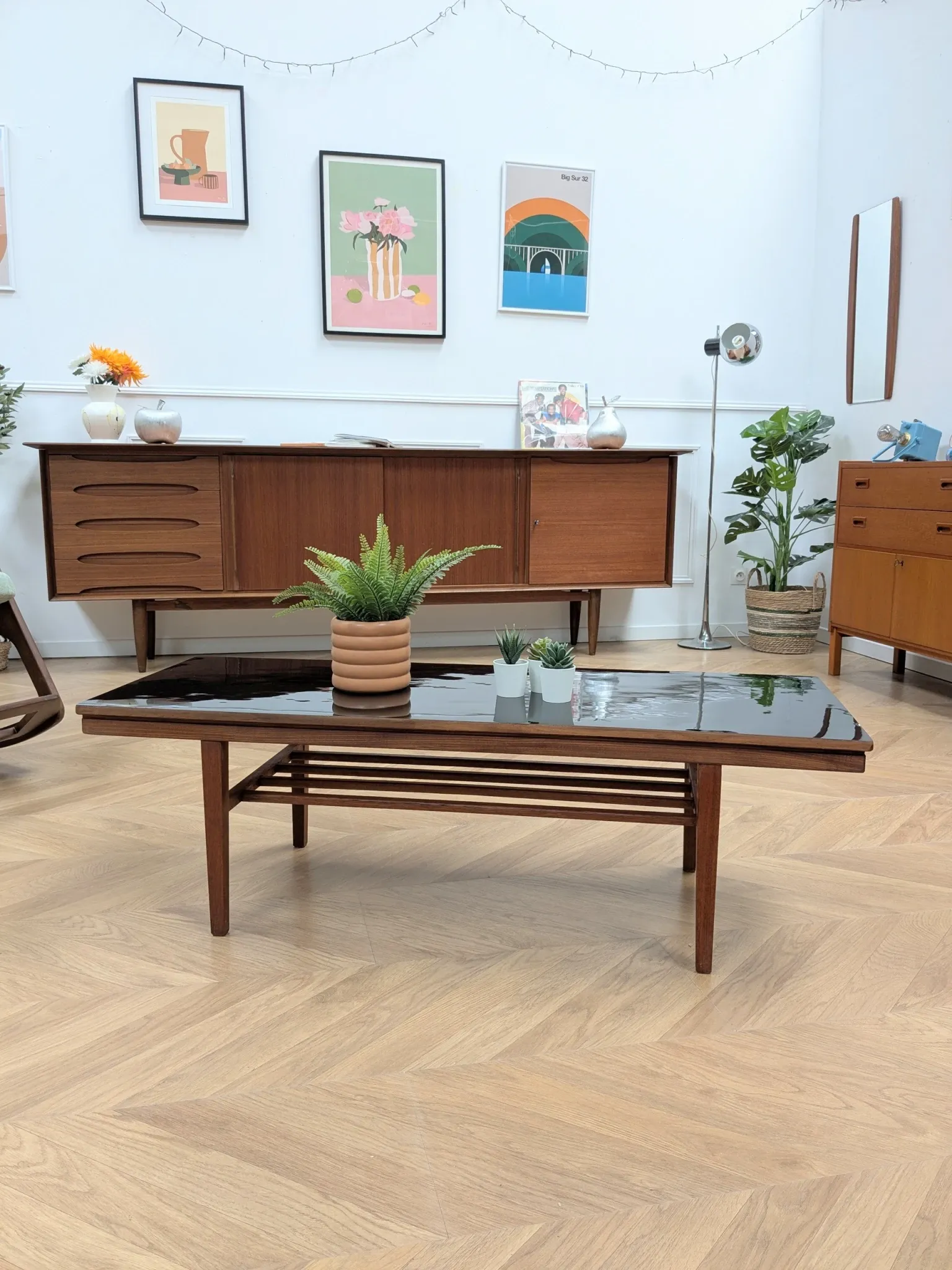 Vintage Danish coffee table in teak with a black top from the 1960s.