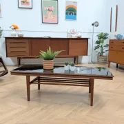 Vintage Danish coffee table in teak with a black top from the 1960s.