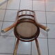 Curved wooden chair, turned and seated in cannage