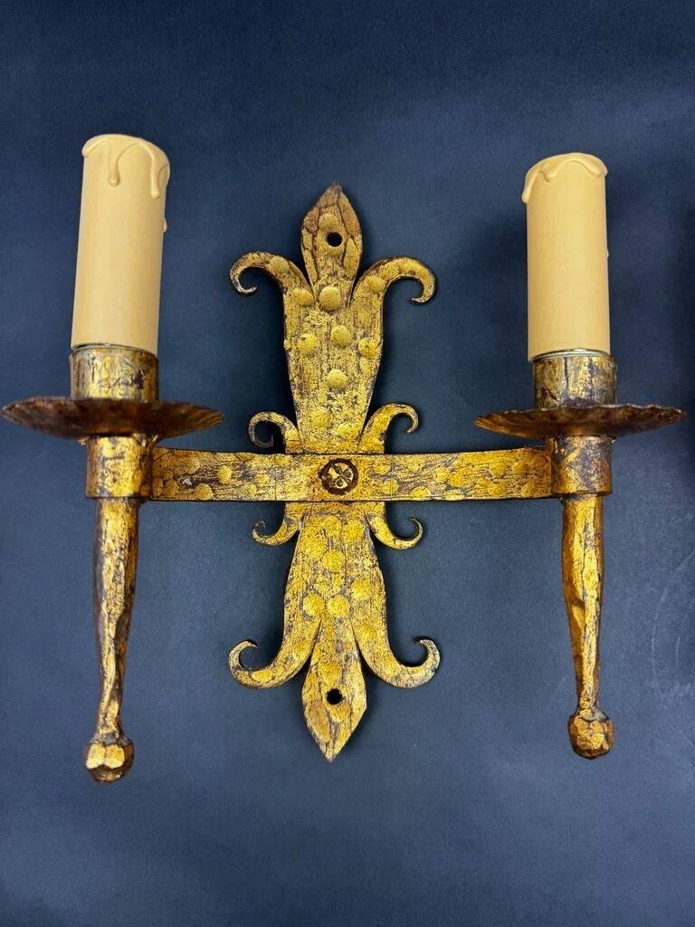 Pair of electrified golden wrought iron gothic wall sconces.