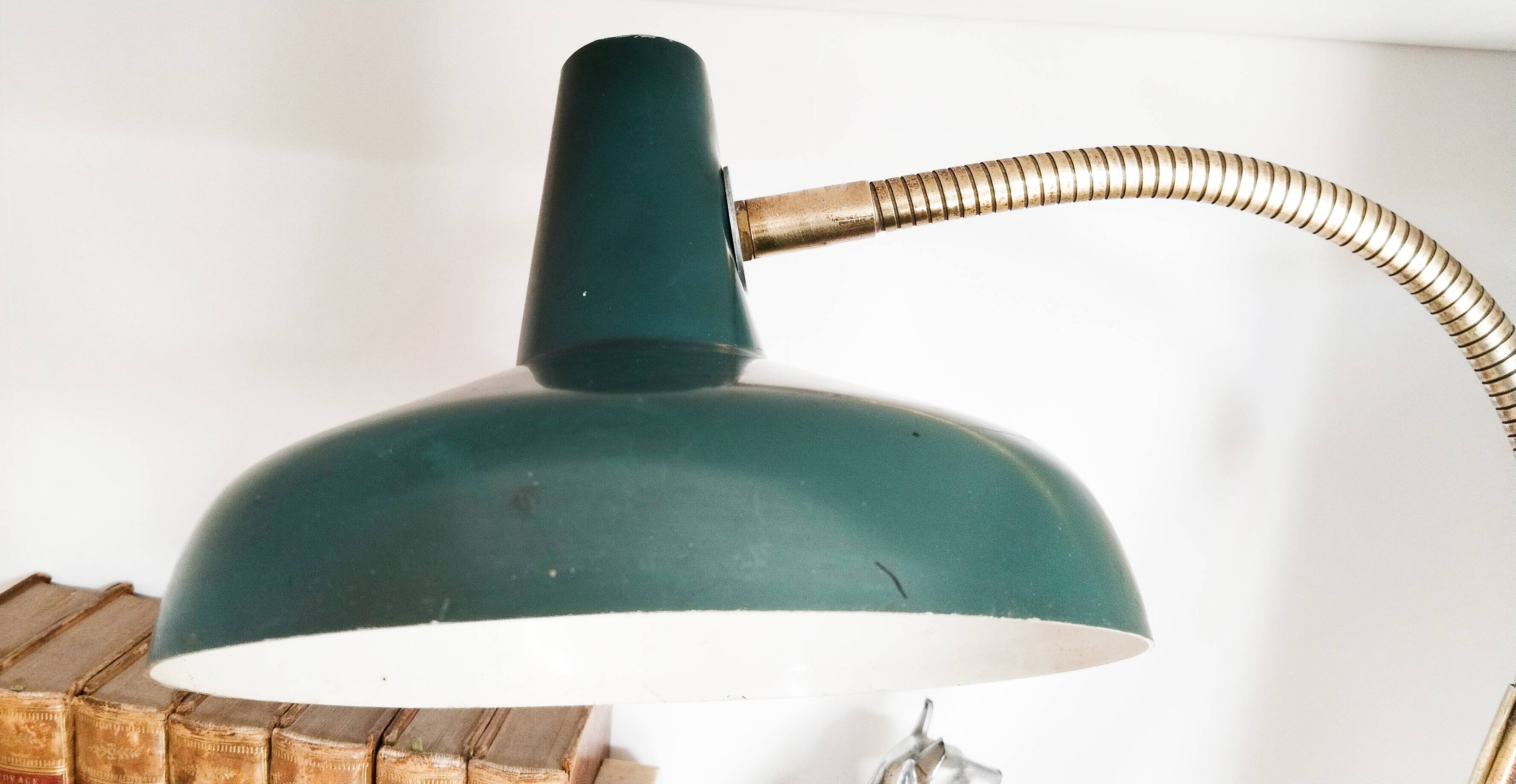 Green and gold articulated desk lamp