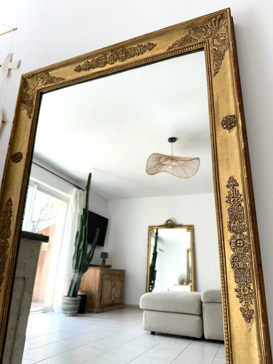 Antique gilded mirror from the Restoration period, 19th century.