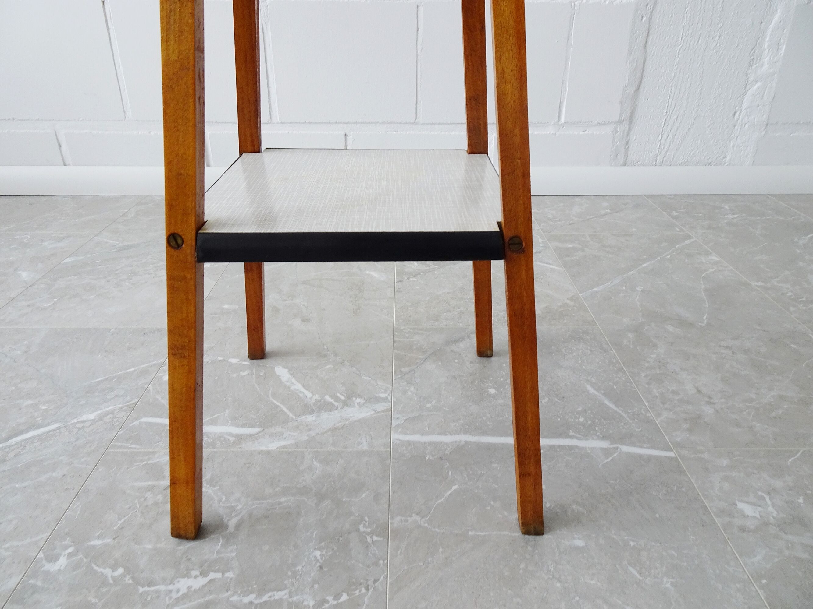 Plant stand made of wood and formica with two shelves, flower column