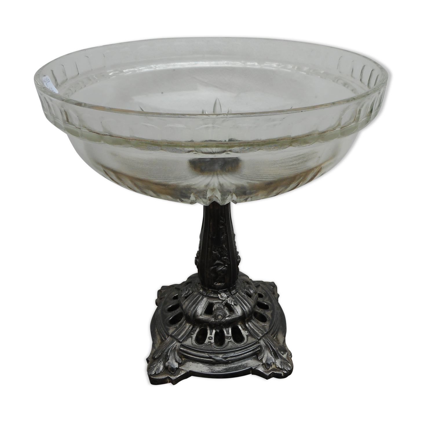 A glass cup on metal stand