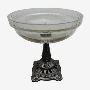 A glass cup on metal stand