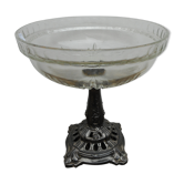 A glass cup on metal stand