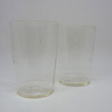 2 old-faceted glasses