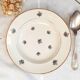 Old hollow plates mismatched in earthenware with gilded edges