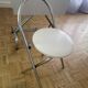 Small stools in metal and faux leather.