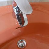 Vintage sink and its orange shelf