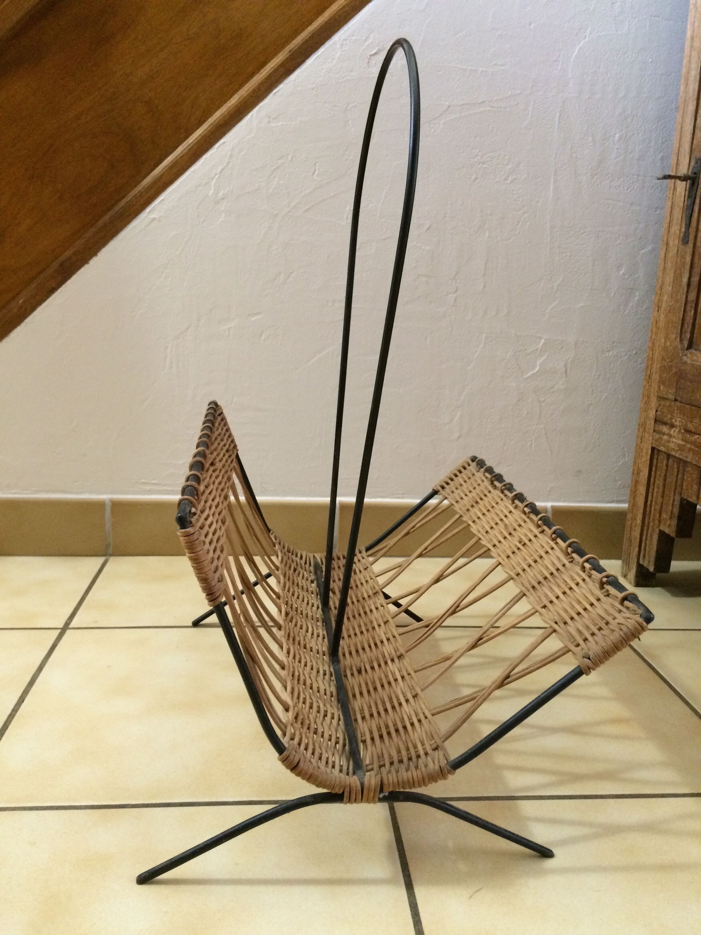 Wearing vintage rattan and black iron design magazines of the 1960s.