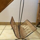 Wearing vintage rattan and black iron design magazines of the 1960s.