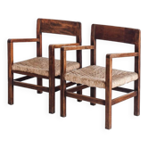 Paire de fauteuils rustiques en bois massif et assises en paille. France, années 1940
