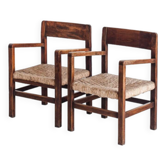 Pair of rustic armchairs in solid wood and straw seats. France, 1940s