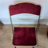 Chaise pliante en métal doré et velours rouge