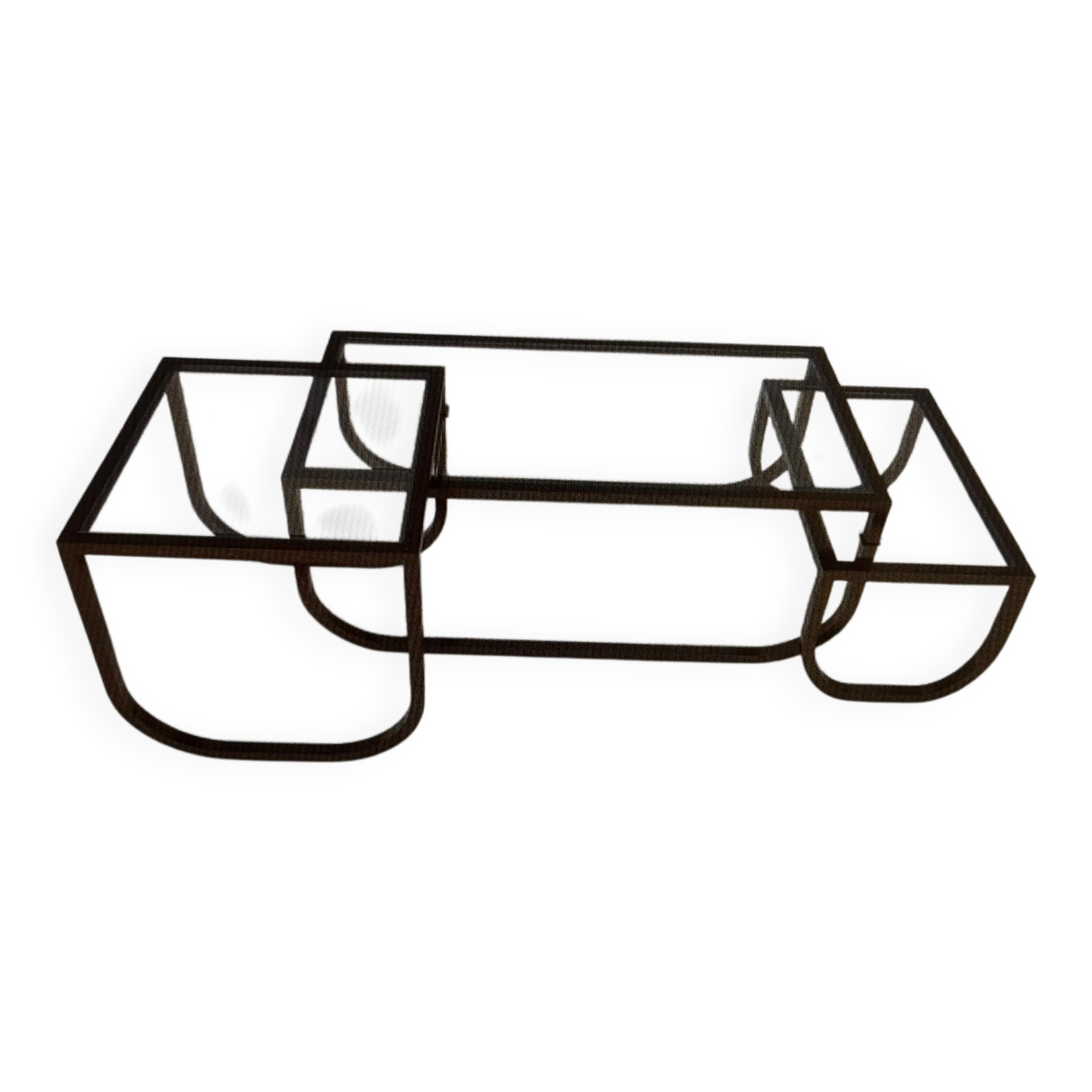 Asymmetrical metal-and-glass coffee table with curved architectural frame.