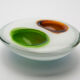 ashtray in white glass and green and orange "bubbles", 70s