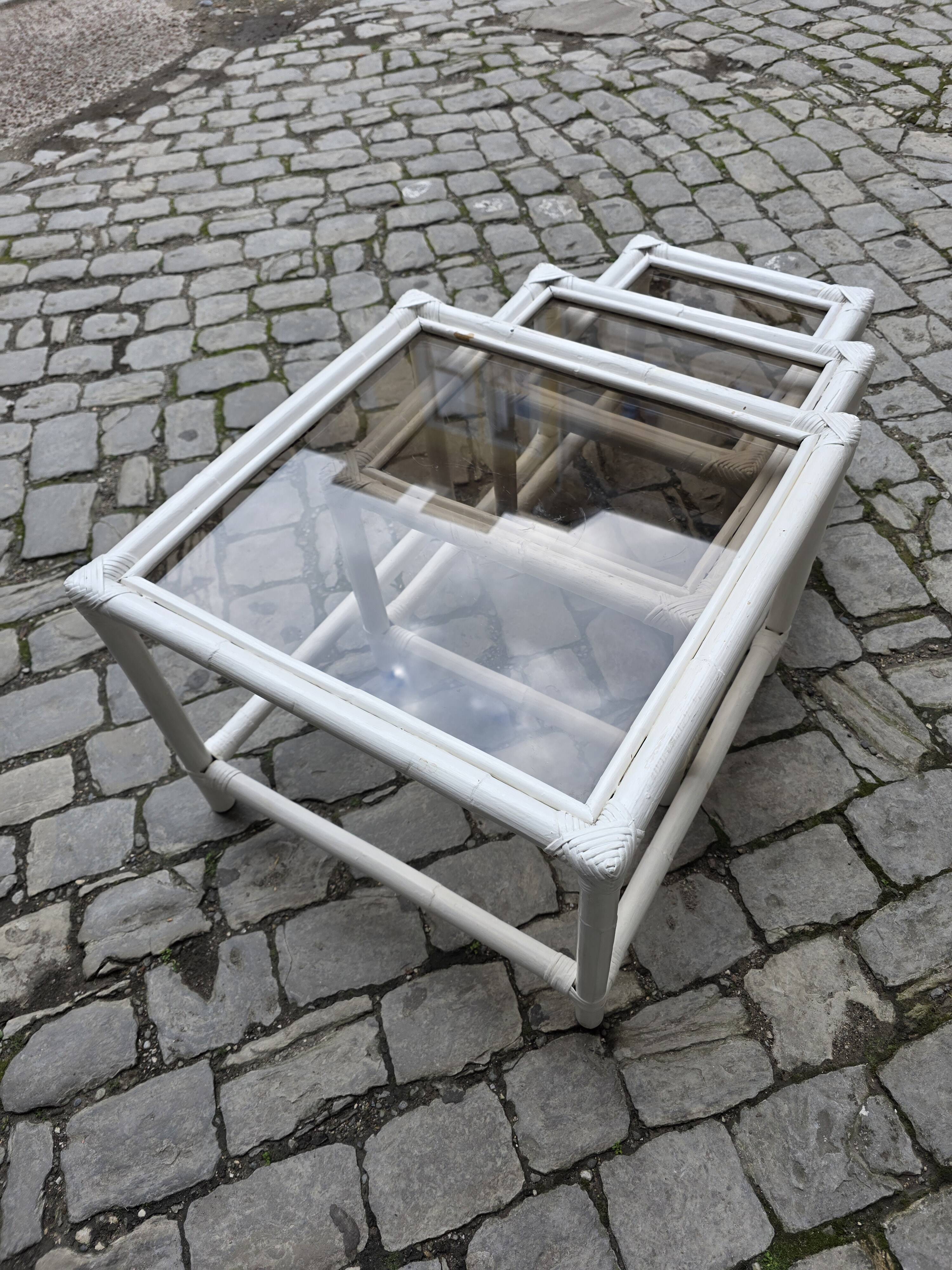 Nest of bamboo and smoked glass tables from the 1970s.